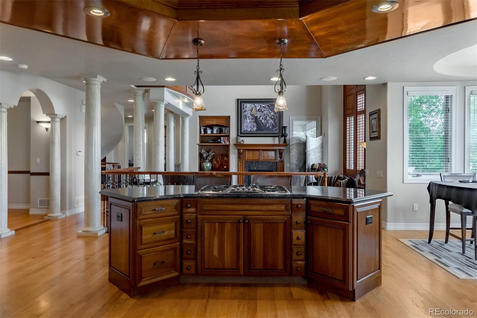 2671 Ranch Reserve Ridge Westminster, CO 80234 - Photo 8 of 35 a kitchen with a stove a refrigerator and chairs