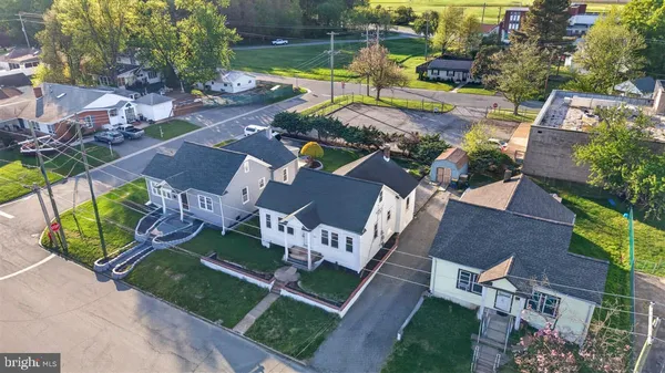 an aerial view of a house with a garden