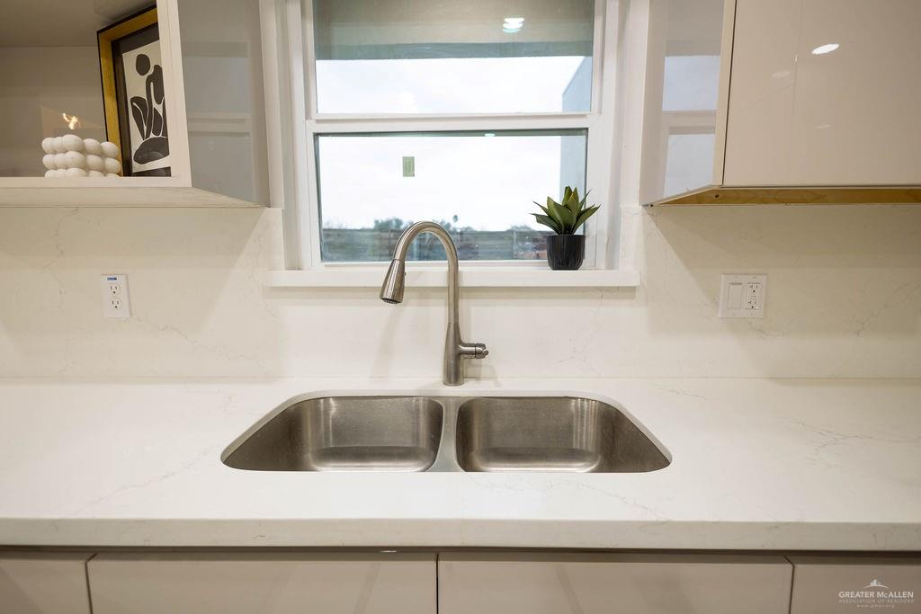 2209 Corales Street Mission, TX 78573 - Photo 11 of 30 a kitchen with a sink and a window