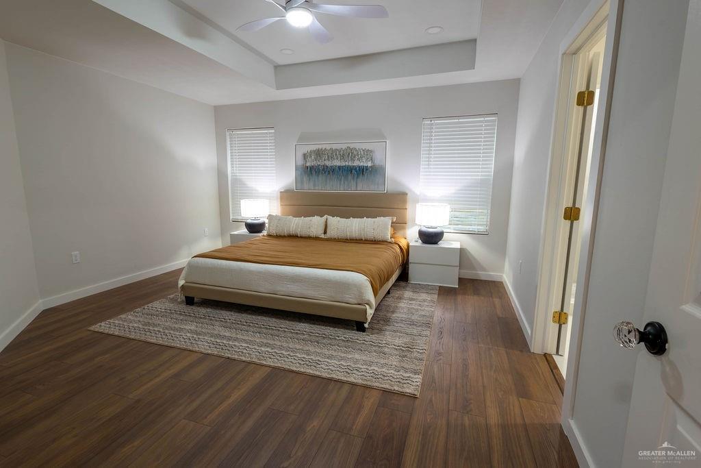 2209 Corales Street Mission, TX 78573 - Photo 16 of 30 a bedroom with a bed and wooden floor