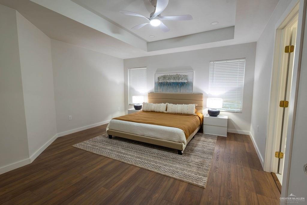 2209 Corales Street Mission, TX 78573 - Photo 17 of 30 a bedroom with a bed and a table