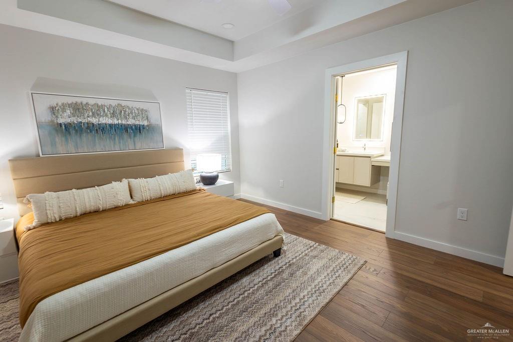 2209 Corales Street Mission, TX 78573 - Photo 20 of 30 a bedroom with a bed and wooden floor