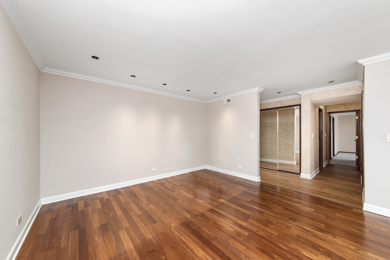 1-s150 Spring Road, Unit 2E Oak Brook, IL 60181 - Photo 9 of 22 a view of an empty room with wooden floor