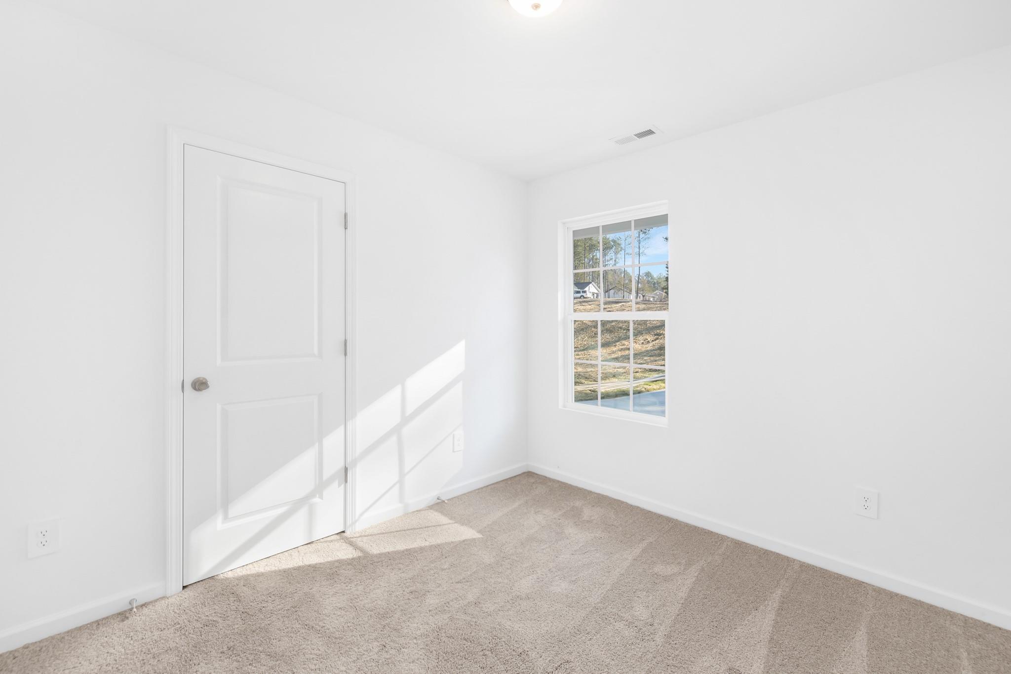 1076 Westminster Drive Lancaster, SC 29720 - Photo 11 of 19 a view of an empty room with a window