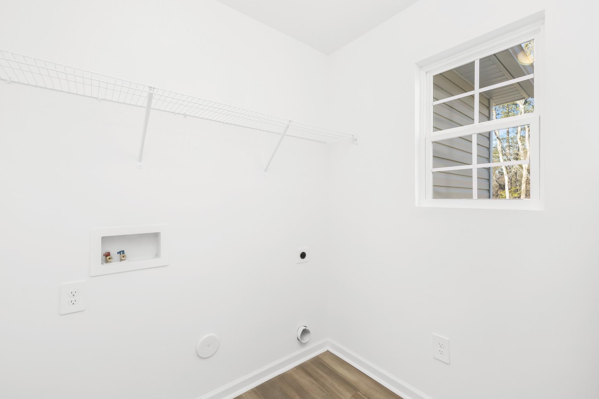 1076 Westminster Drive Lancaster, SC 29720 - Photo 16 of 19 a view of storage and utility room with wooden floor