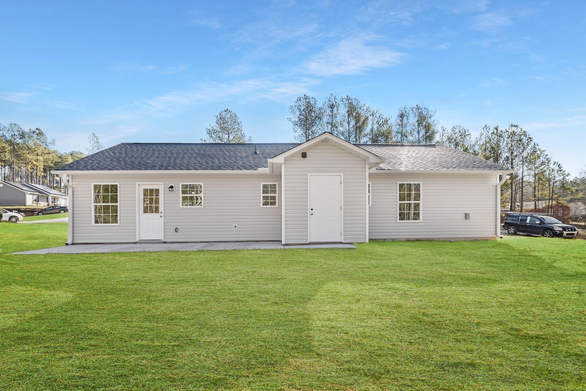 1076 Westminster Drive Lancaster, SC 29720 - Photo 17 of 19 a front view of a house with a yard