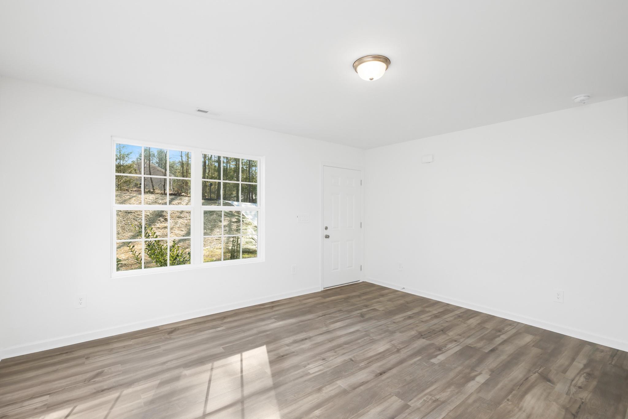 1076 Westminster Drive Lancaster, SC 29720 - Photo 3 of 19 an empty room with a window