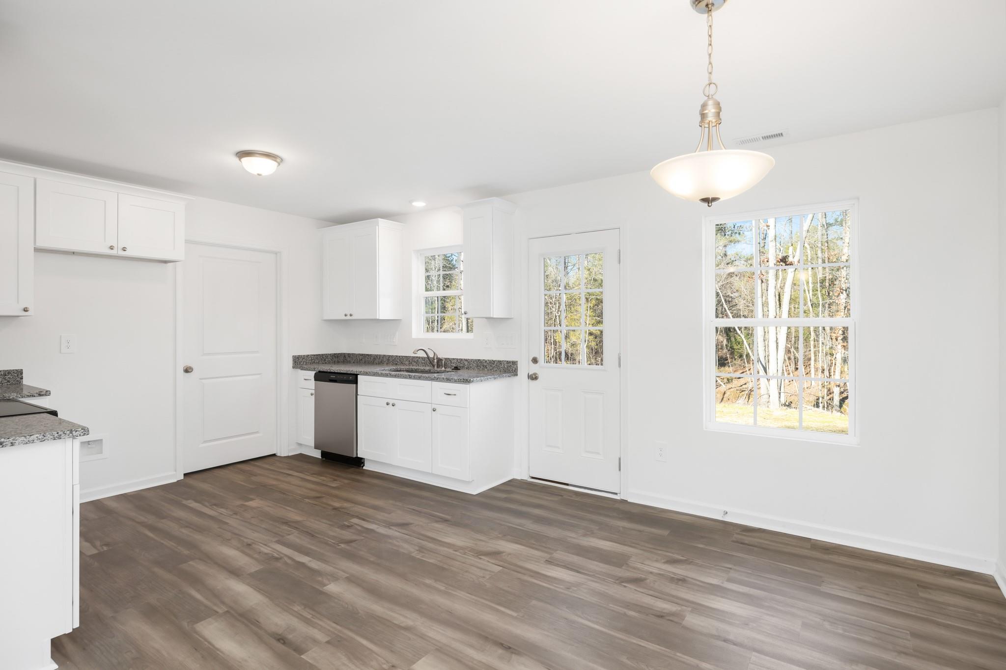 1076 Westminster Drive Lancaster, SC 29720 - Photo 6 of 19 a kitchen with a refrigerator and window
