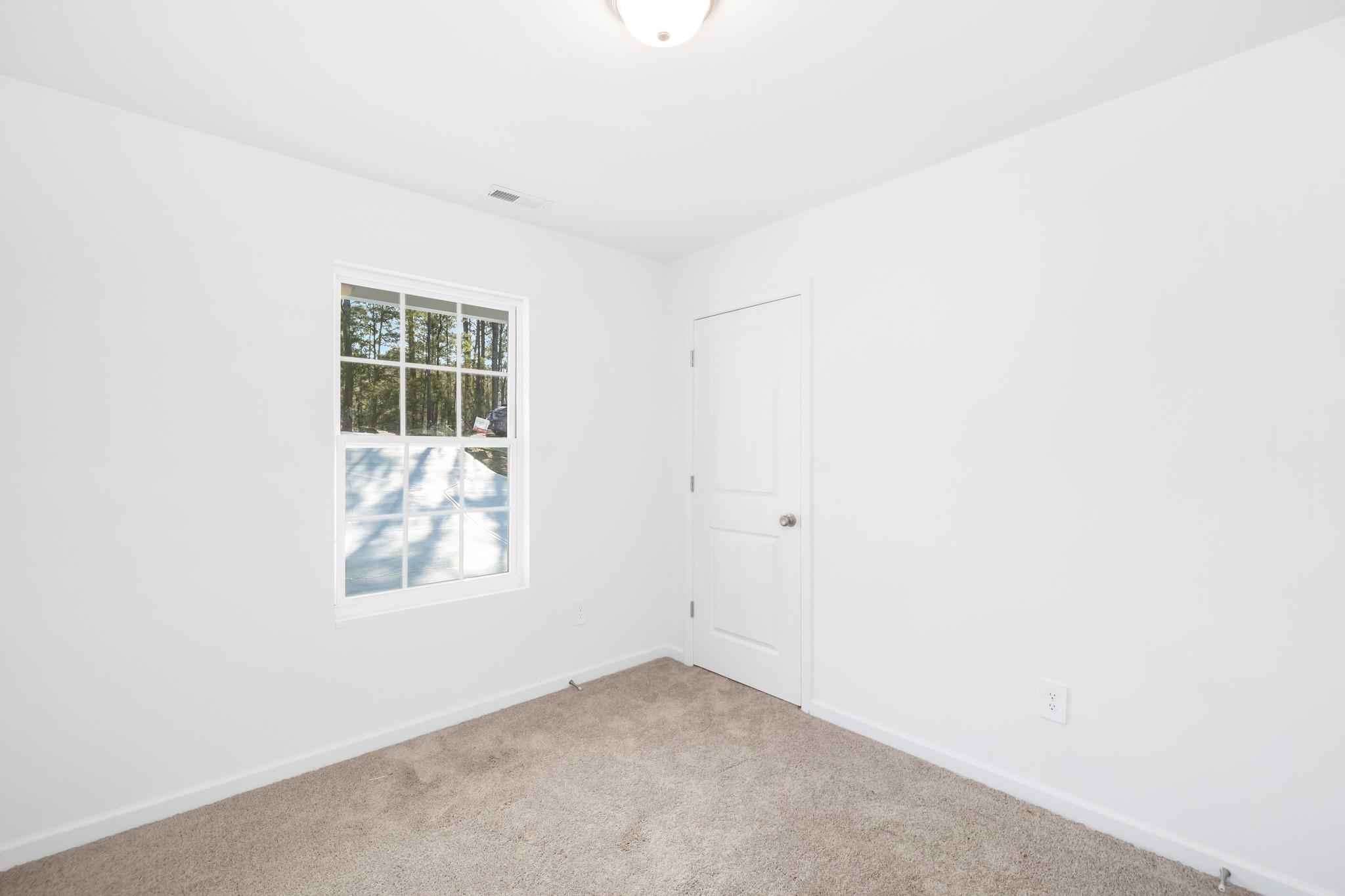 1076 Westminster Drive Lancaster, SC 29720 - Photo 10 of 19 an empty room with windows