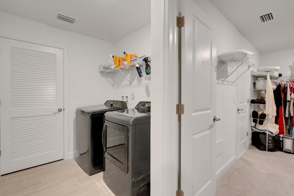 12328 Southwest Roma Circle Port St. Lucie, FL 34987 - Photo 43 of 72 Laundry to Primary Walk-in Closet.jpeg-S