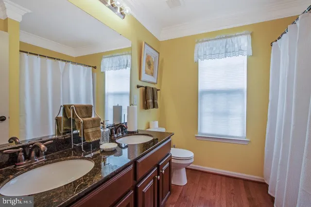 a large house with a big yard and large trees