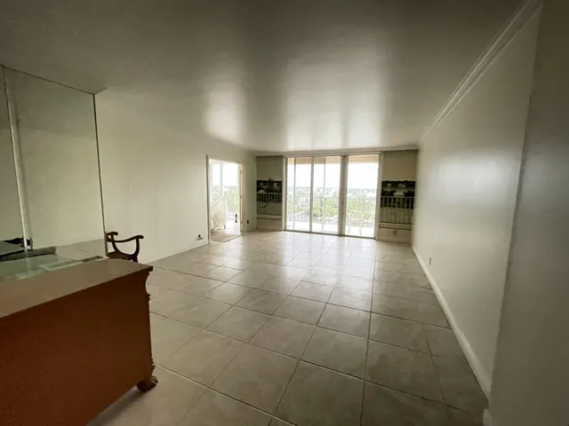 a lobby with a granite countertop sink and vanity
