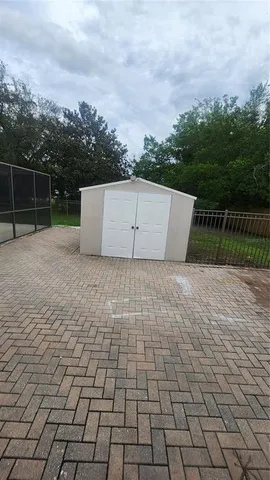a view of house with backyard and garden