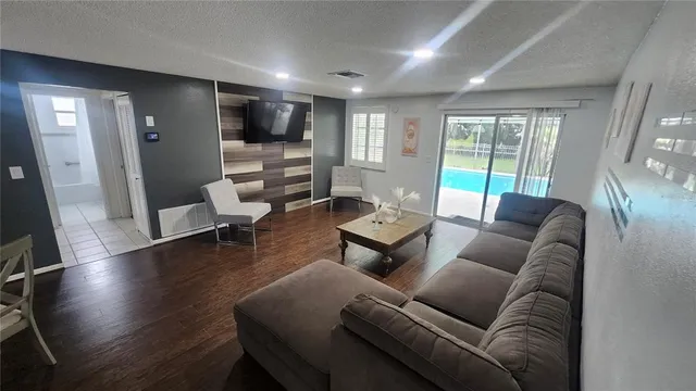 a view of a dining room with furniture window and wooden floor