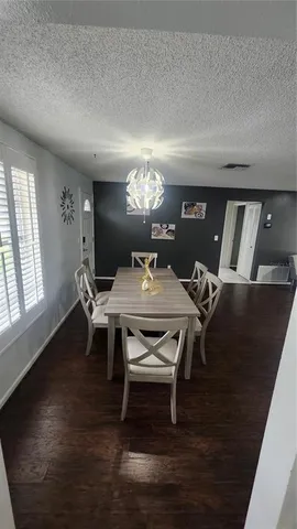 a kitchen with a sink a stove and cabinets