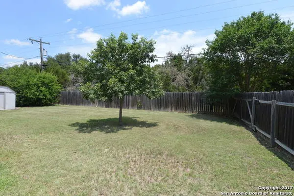 a backyard of a house with lots of green space