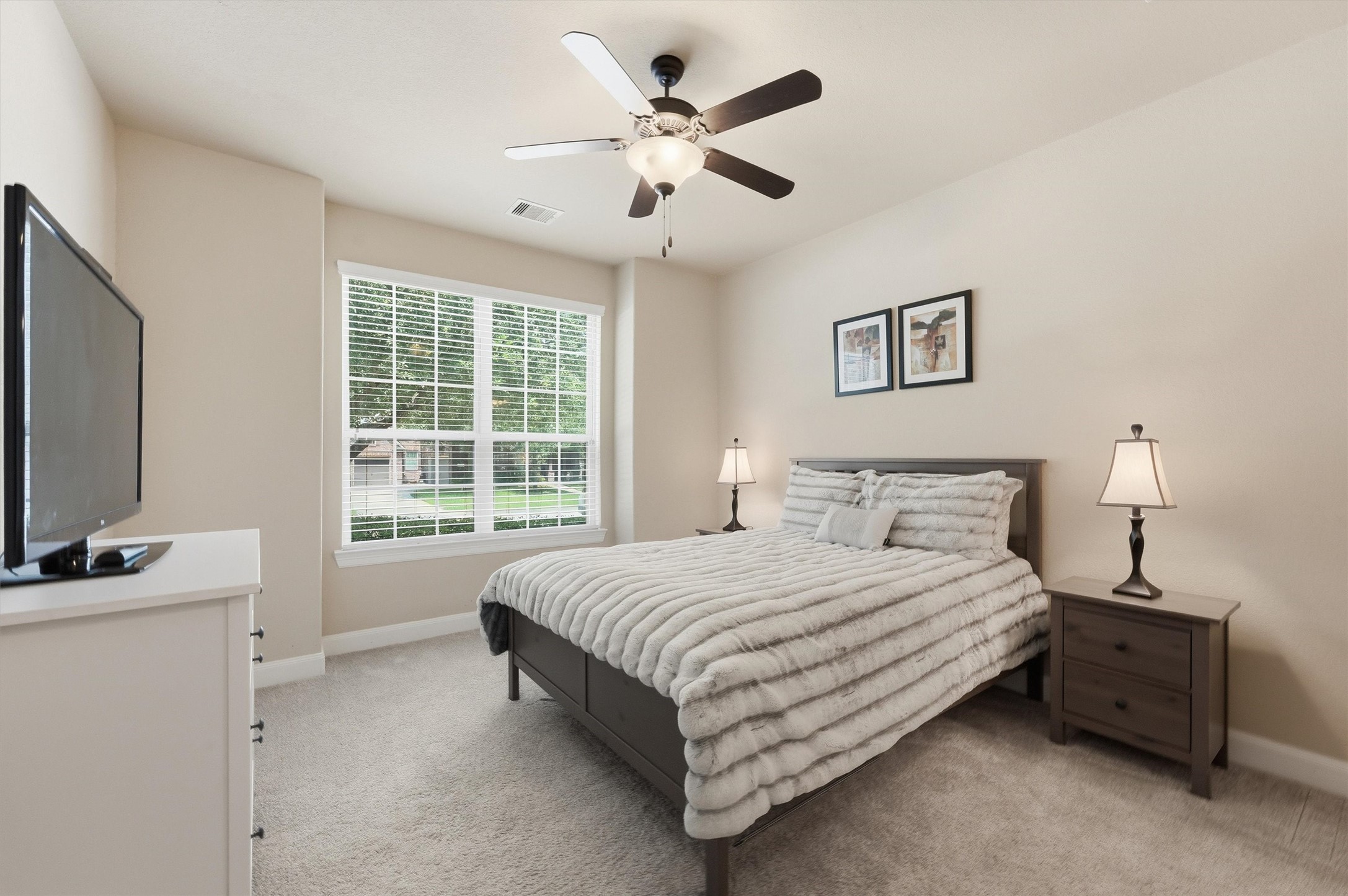 17710 Rough River Court Humble, TX 77346 - Photo 12 of 38 Downstairs guest suite! This secondary bedroom boasts a private full bath attached perfect for in-laws, adult children, or visiting guests who want their own space.
