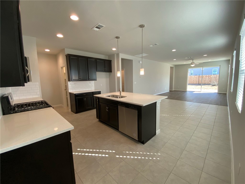 384 Gaida Loop Georgetown, TX 78628 - Photo 20 of 20 Very open and bright floor plan. Enjoy cooking and entertaining in this kitchen boasting a center island, stainless steel appliances and gas range.