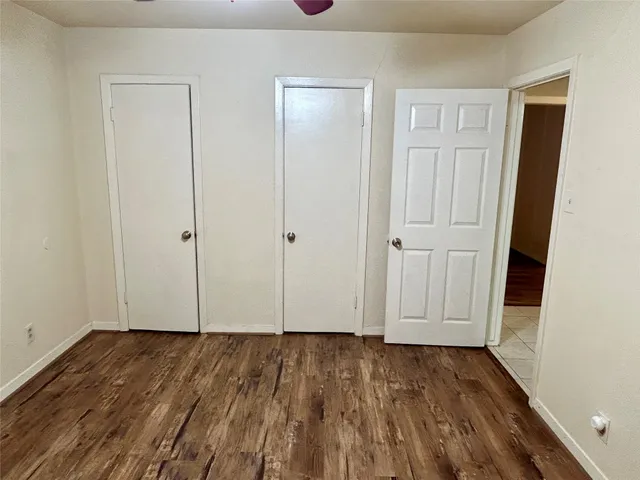 a view of room with hardwood floor