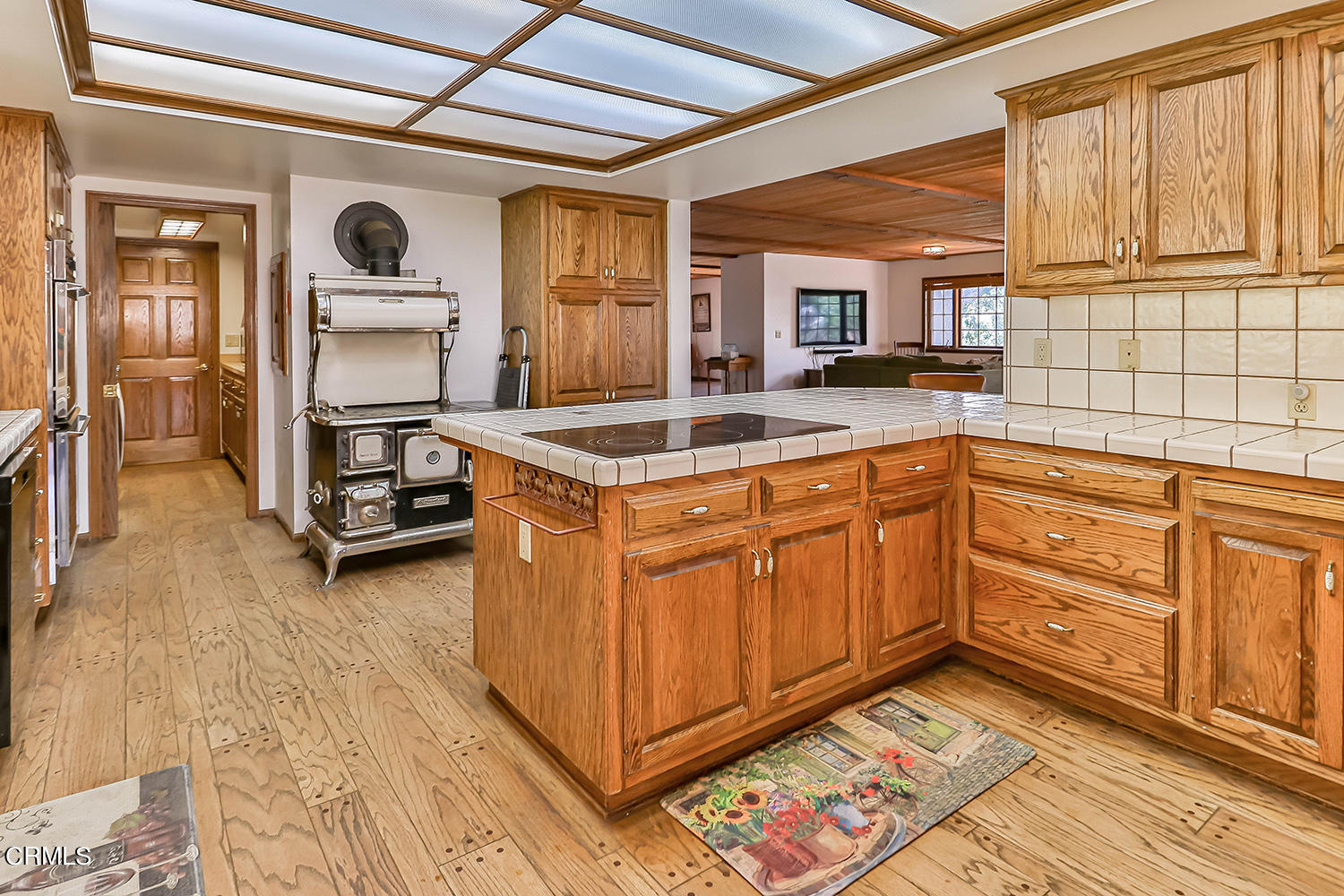 17724 Pigeon Springs Road Tehachapi, CA 93561 - Photo 14 of 59 a kitchen with granite countertop a sink and cabinets