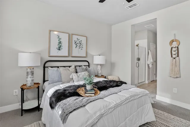 a bedroom with a bed and a lamp