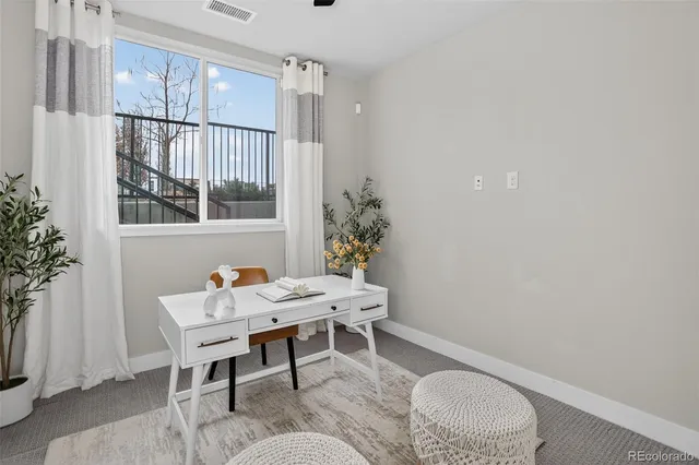 a view of a livingroom with furniture and window
