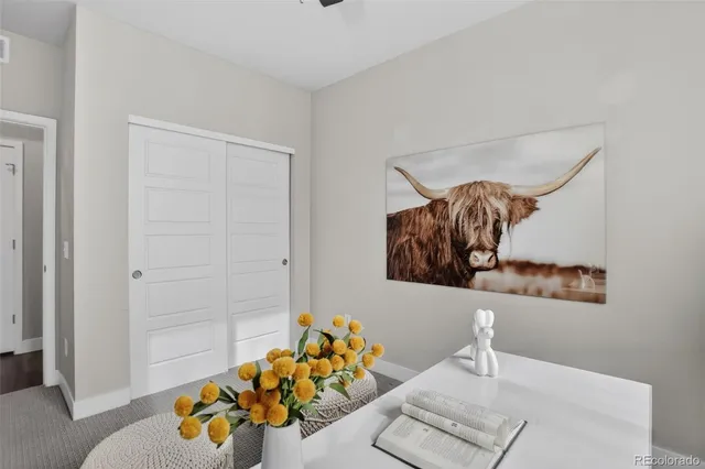 a bedroom with furniture and wooden floor