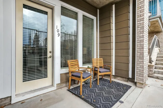 a view of a porch with a table and chair