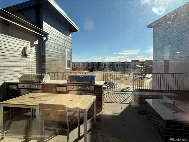 a terrace of a house with outdoor seating