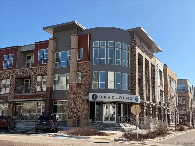 a view of a balcony with furniture