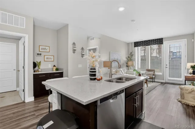 a room with a table chairs and wooden floor