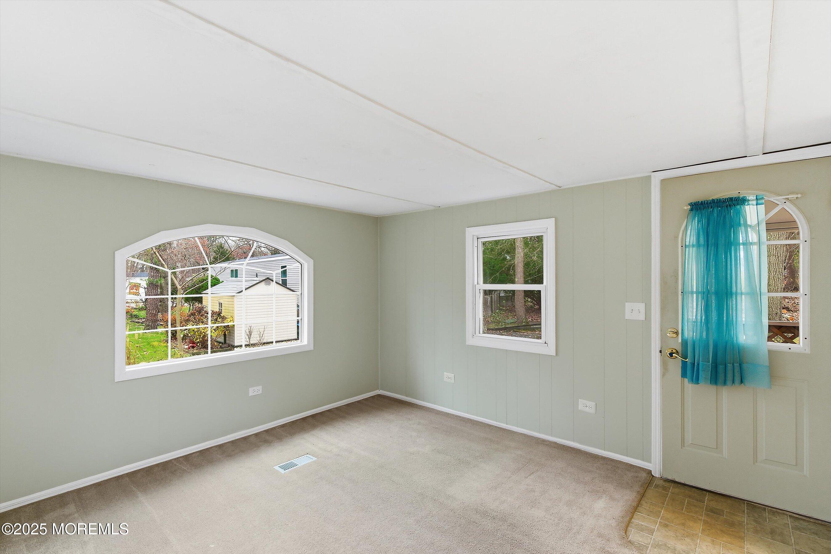 1 Loblolly Lane Jackson, NJ 08527 - Photo 1 of 19 an empty room with a window
