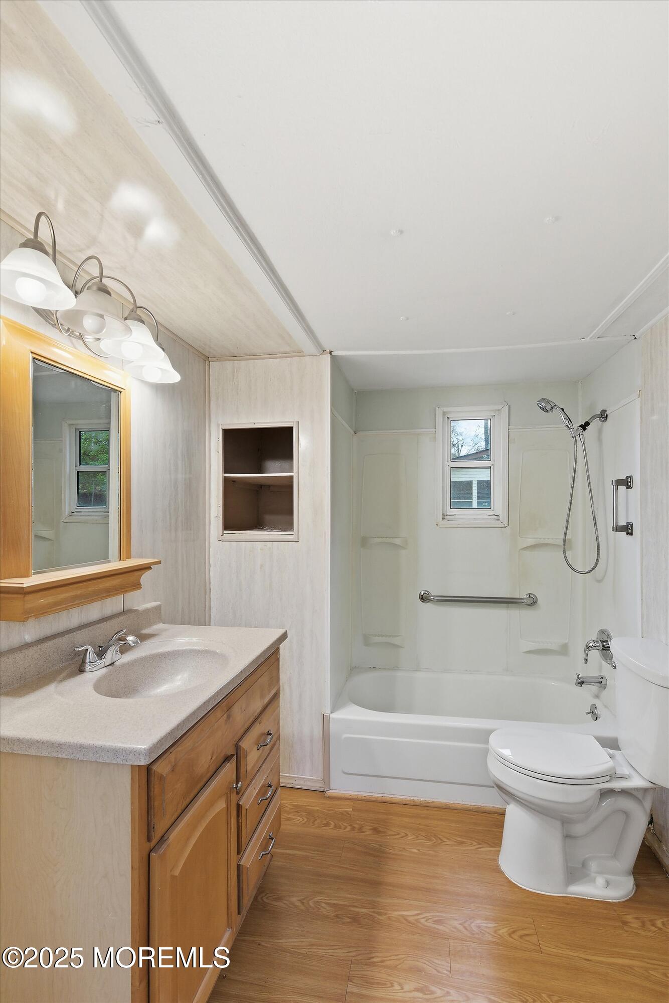 1 Loblolly Lane Jackson, NJ 08527 - Photo 12 of 19 a bathroom with a sink a toilet a mirror and bathtub