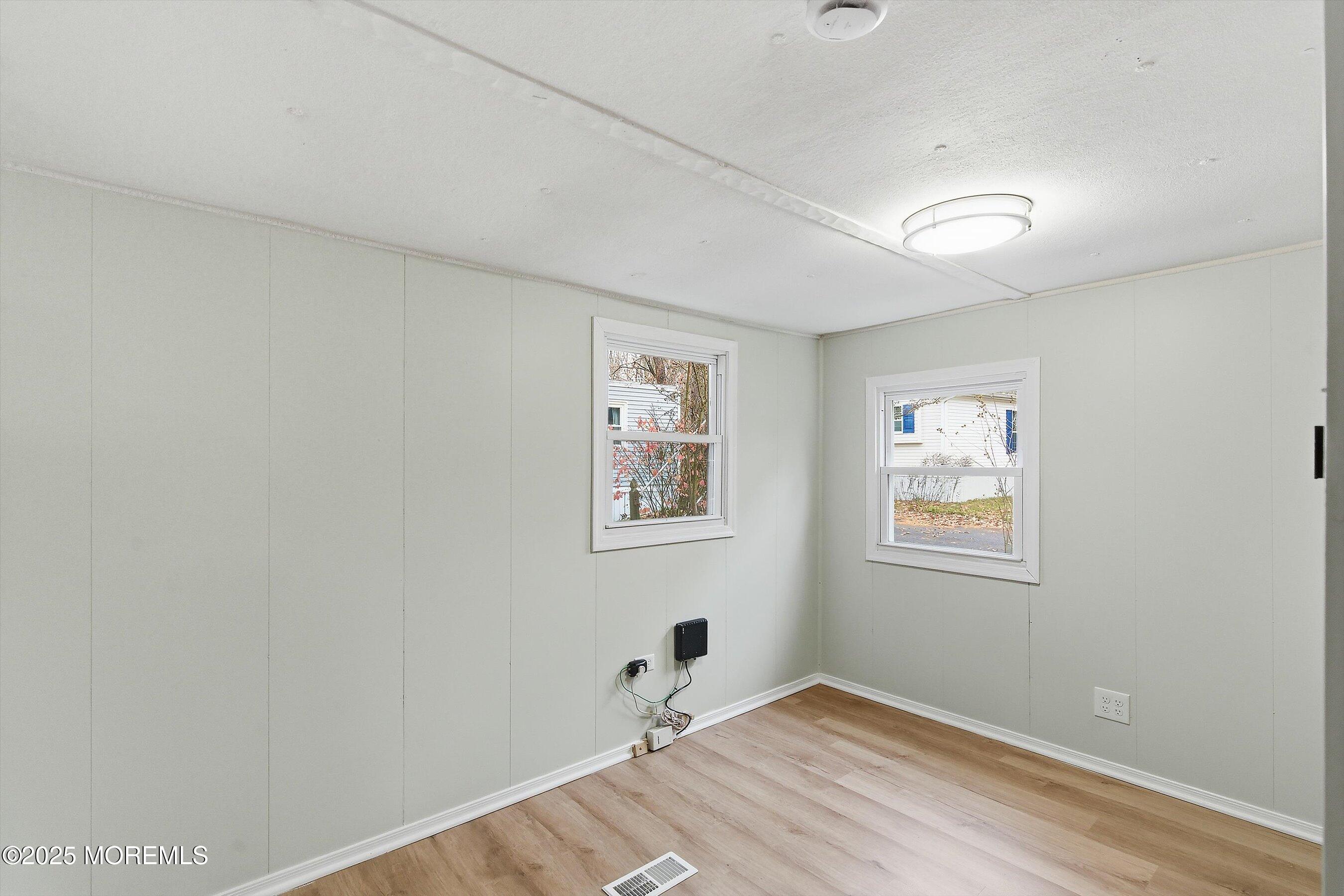 1 Loblolly Lane Jackson, NJ 08527 - Photo 7 of 19 a view of a bedroom with wooden floor and a window