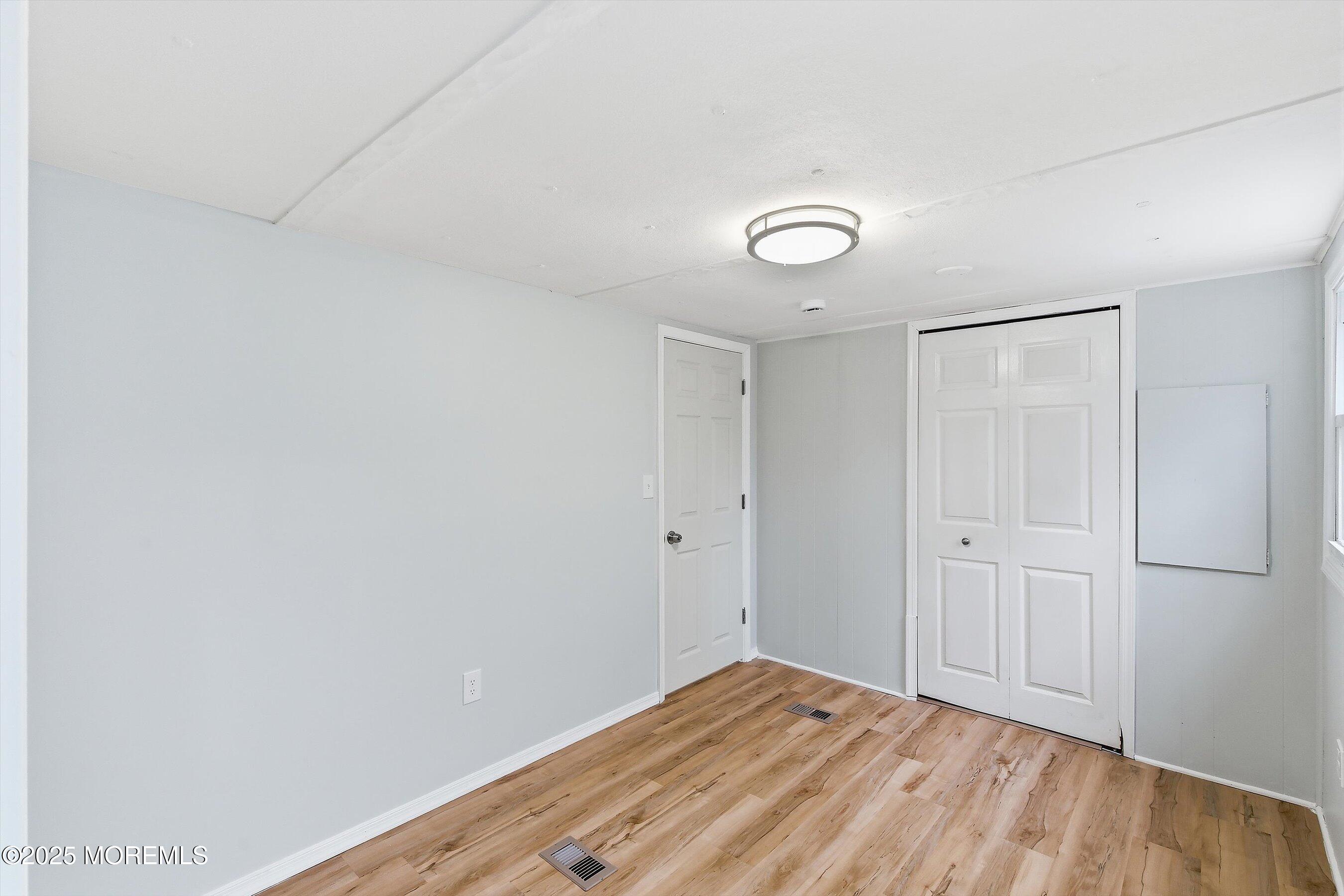 1 Loblolly Lane Jackson, NJ 08527 - Photo 9 of 19 a view of empty room with wooden floor