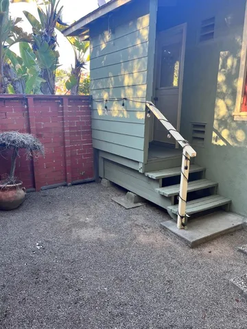 a view of a room with stairs and a couch