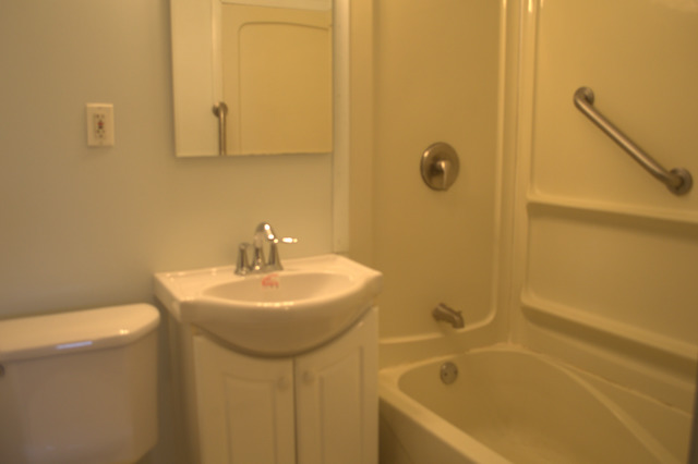 25 Marnel Road Montgomery, IL 60538 - Photo 11 of 22 a bathroom with a sink a toilet and shower