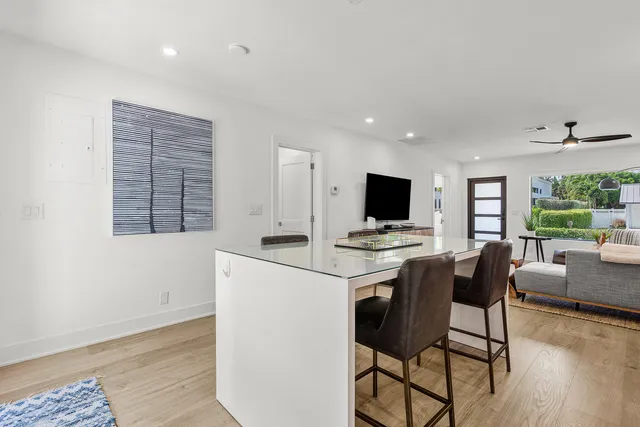 a view of kitchen with furniture and wooden floor