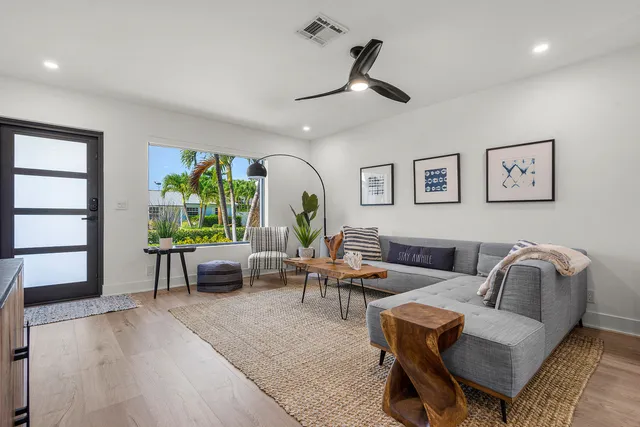 a living room with furniture and a large window