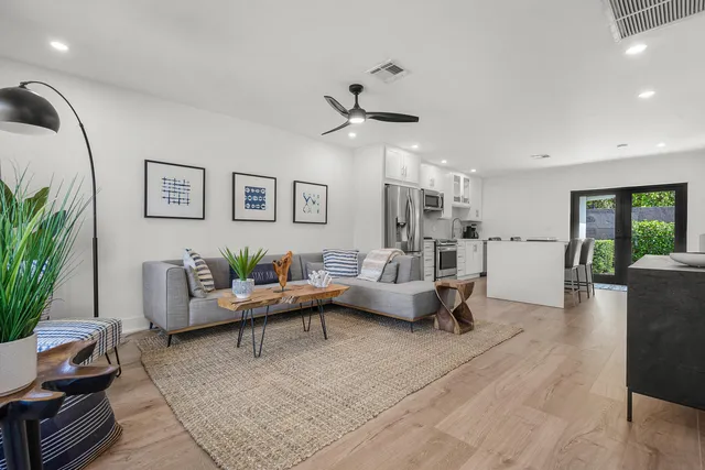 a living room with furniture and a table