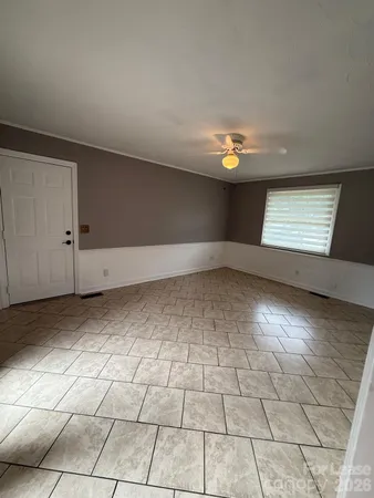 a view of an empty room and window