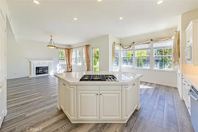 a view of a hallway with wooden floor and closet