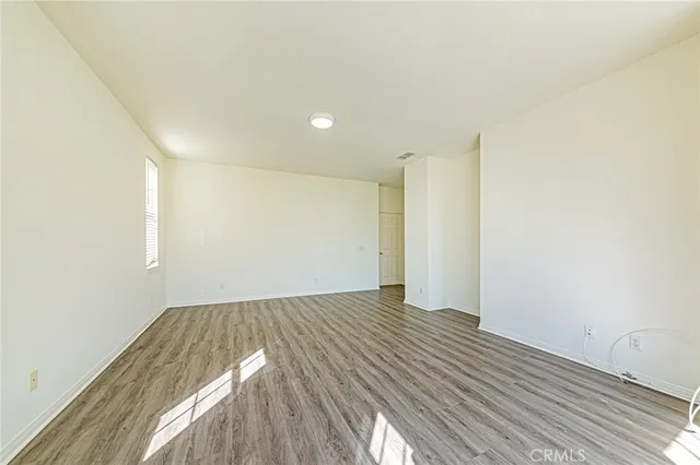 a spacious bathroom with a shower sink and mirror