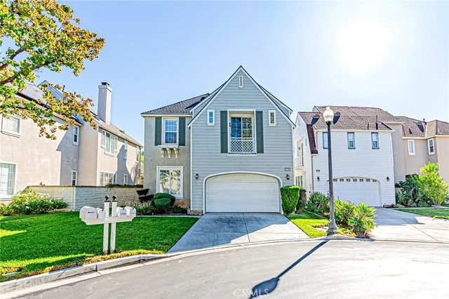 a view of a patio with furniture and a umbrella
