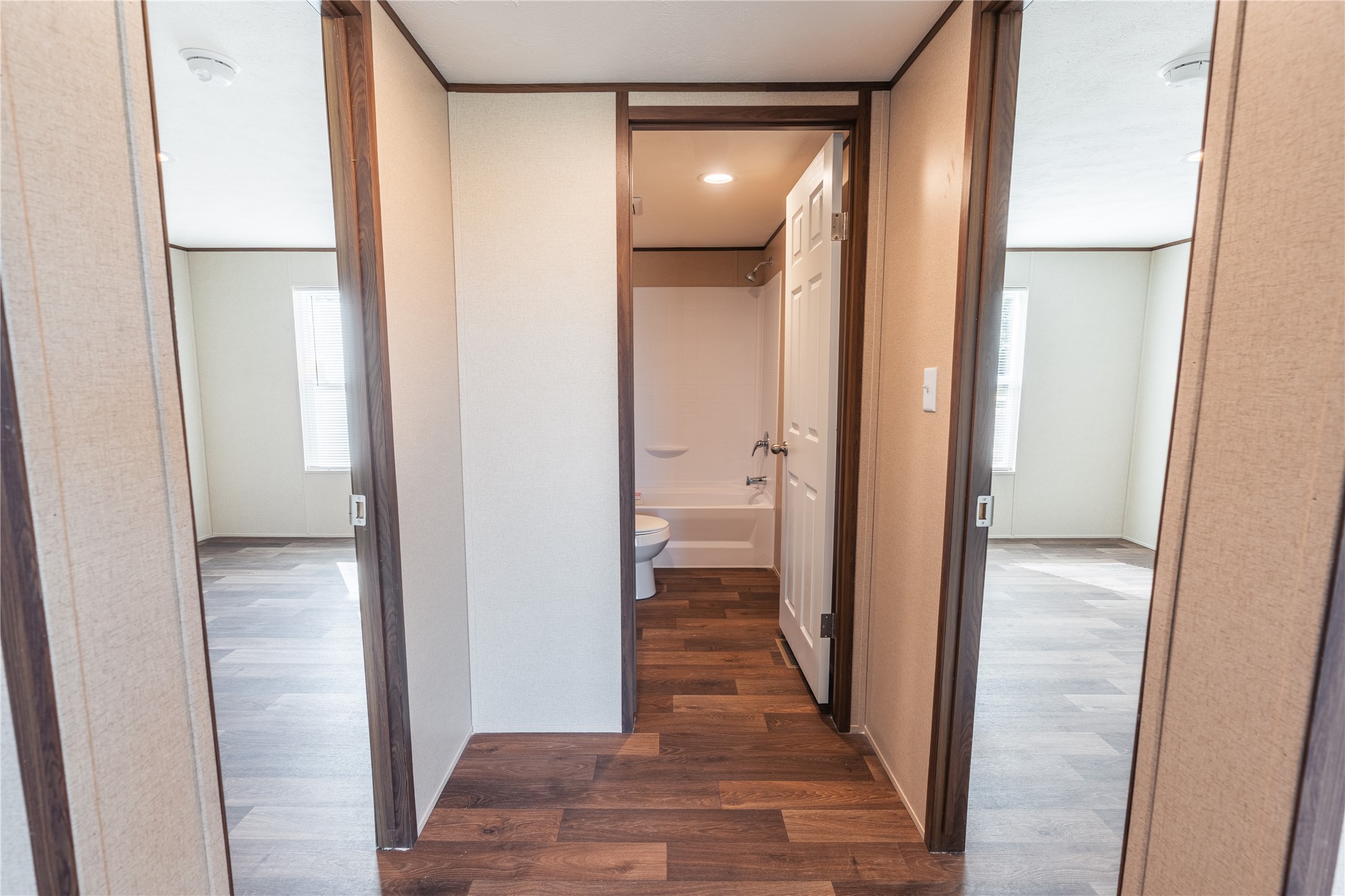 6945 Seawillow Road Lockhart, TX 78644 - Photo 12 of 22 a view of a bathroom from the hallway