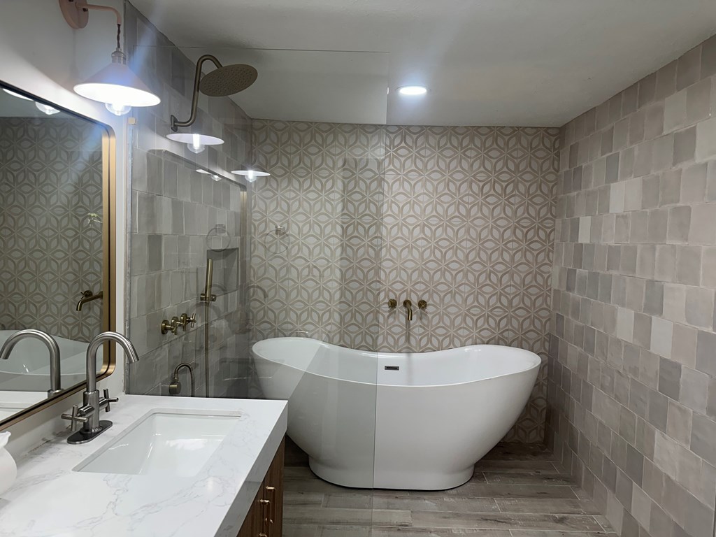 2880 Lamb Road Smiths Station, AL 36877 - Photo 14 of 17 a bathroom with a bathtub and shower