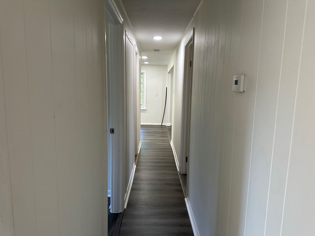 2880 Lamb Road Smiths Station, AL 36877 - Photo 15 of 17 a view of a hallway with wooden floor