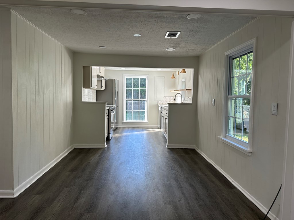 2880 Lamb Road Smiths Station, AL 36877 - Photo 17 of 17 an empty room with wooden floor and windows