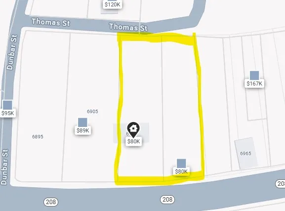 a view of a swimming pool with sitting area