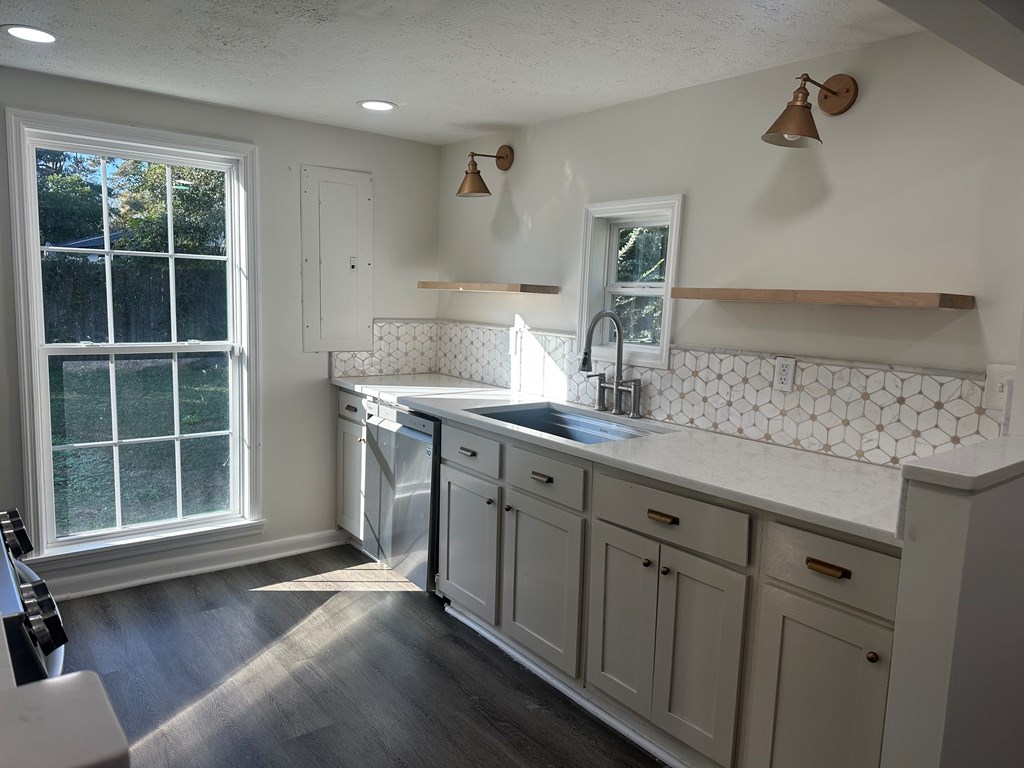 2880 Lamb Road Smiths Station, AL 36877 - Photo 7 of 17 a kitchen with a sink cabinets and window